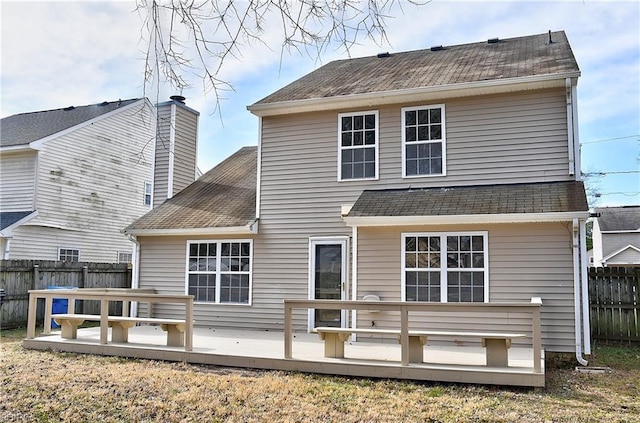 back of property featuring a deck