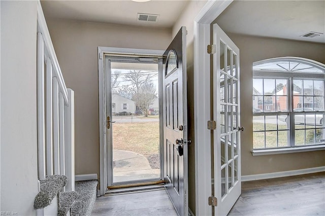 entryway with light hardwood / wood-style floors