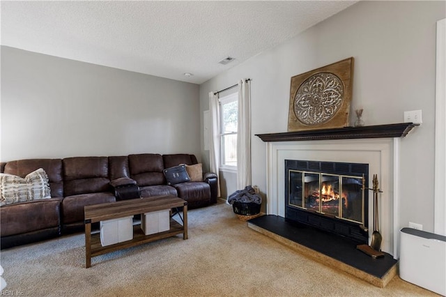 living room featuring light carpet and a textured ceiling