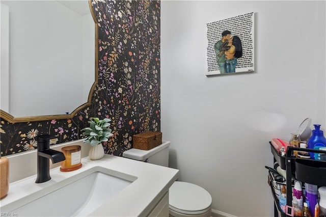 bathroom with vanity and toilet