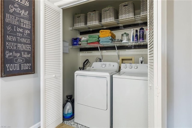 washroom with washer and dryer