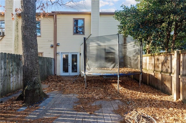 back of house with a patio and french doors