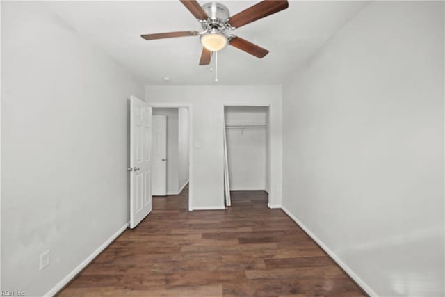 unfurnished bedroom with a closet, dark hardwood / wood-style floors, and ceiling fan