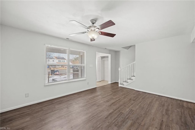 unfurnished living room with ceiling fan and dark hardwood / wood-style floors