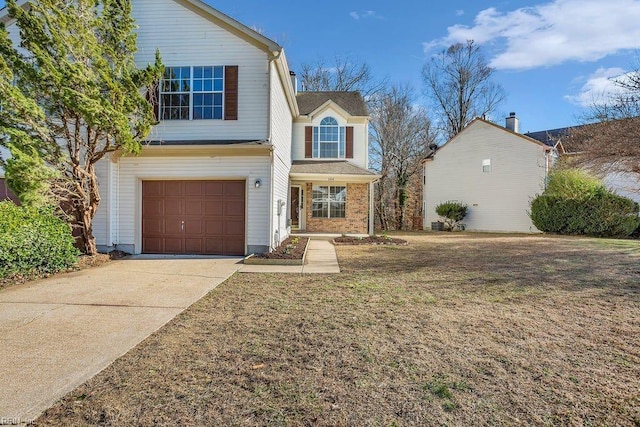 front facade with a garage and a front lawn