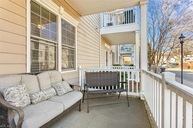 balcony featuring covered porch