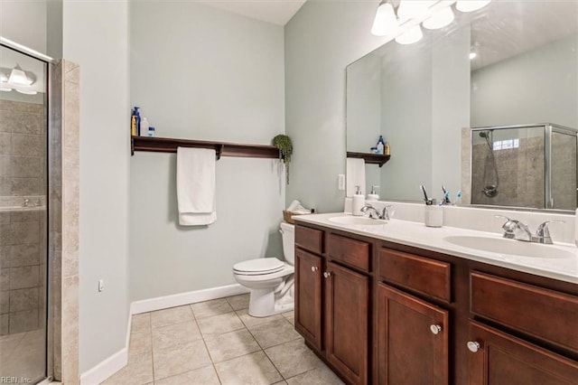 bathroom featuring walk in shower, vanity, toilet, and tile patterned flooring