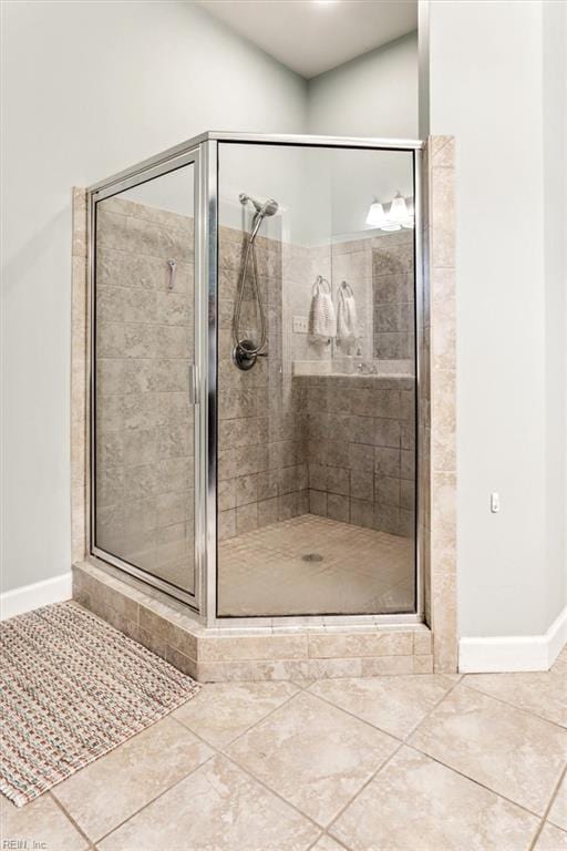 bathroom featuring tile patterned flooring and a shower with door