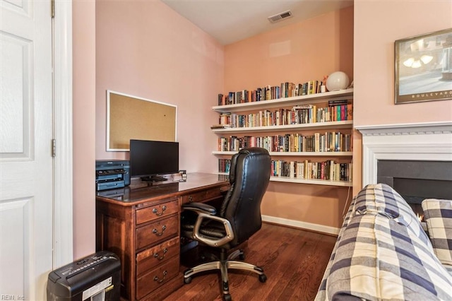 office with dark hardwood / wood-style flooring