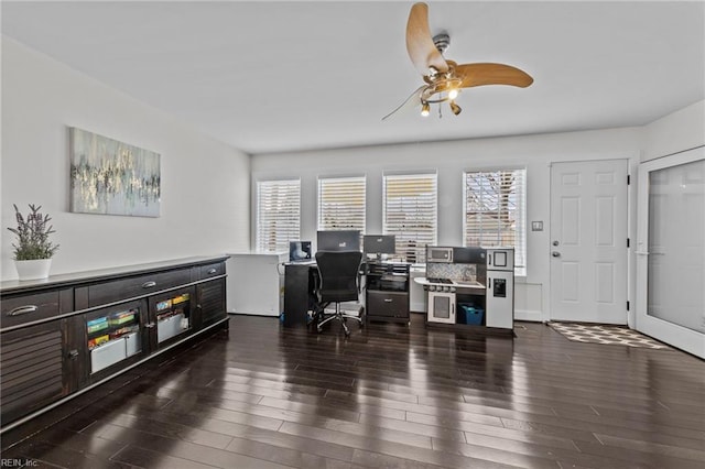 office area with dark wood-type flooring, a wealth of natural light, and ceiling fan