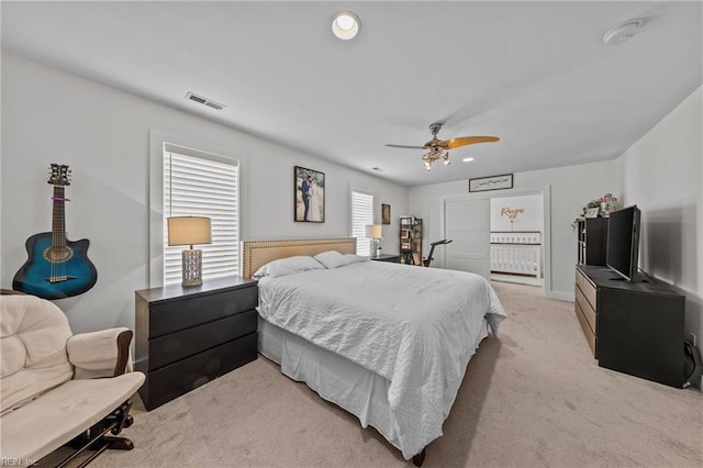 carpeted bedroom featuring ceiling fan