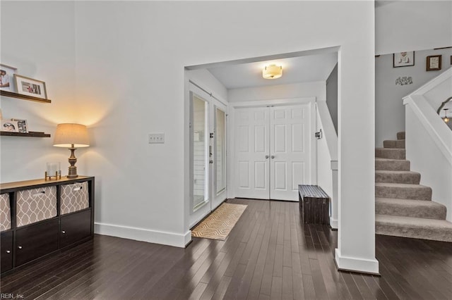 foyer with dark hardwood / wood-style flooring