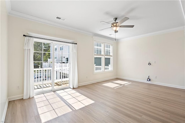 empty room featuring ornamental molding, ceiling fan, and light hardwood / wood-style flooring