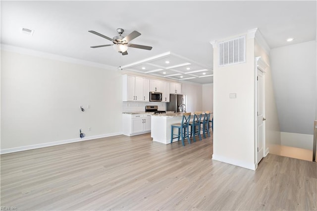 living room with crown molding, ceiling fan, and light hardwood / wood-style floors