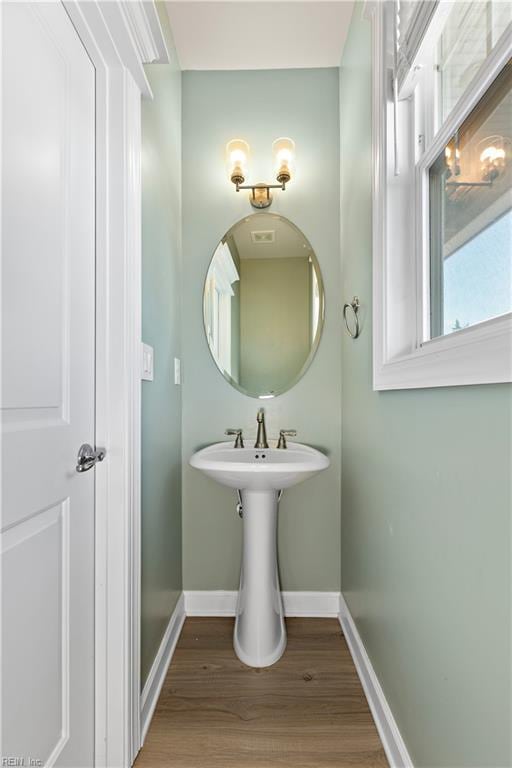 bathroom with hardwood / wood-style flooring