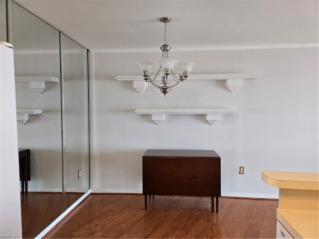 interior details featuring hardwood / wood-style floors and a notable chandelier