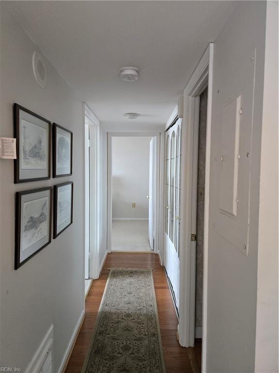 hallway with hardwood / wood-style floors