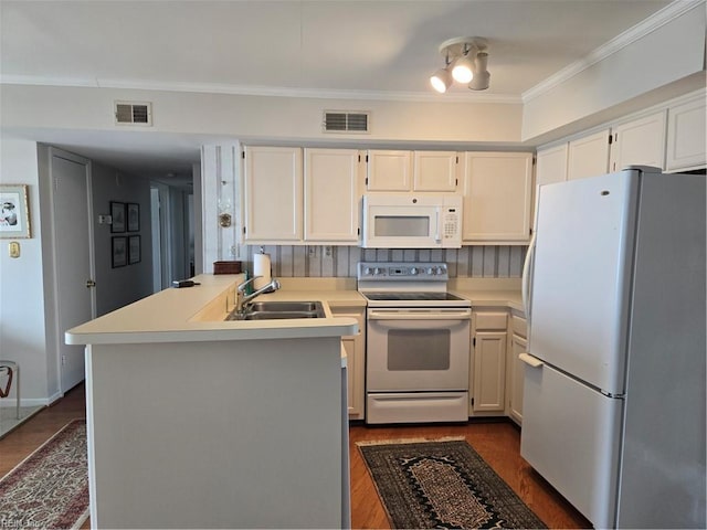 kitchen with white cabinetry, sink, white appliances, and ornamental molding