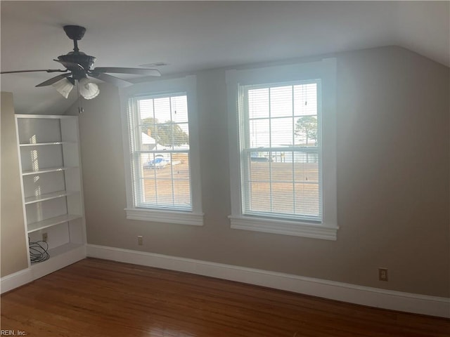 spare room with vaulted ceiling, ceiling fan, and hardwood / wood-style floors