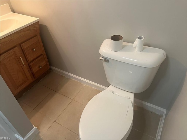 bathroom featuring vanity, tile patterned flooring, and toilet