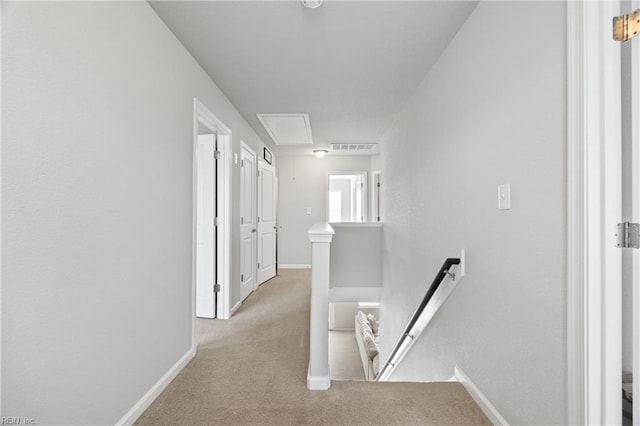 corridor with light colored carpet