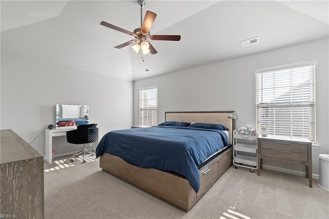 carpeted bedroom featuring ceiling fan and vaulted ceiling