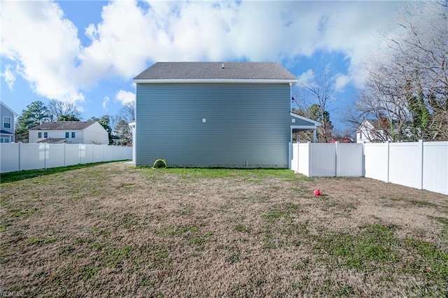 back of property featuring a yard