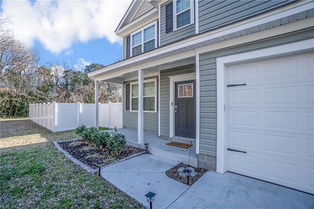 entrance to property with a porch and a garage