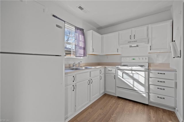 kitchen featuring white cabinetry, sink, white appliances, and light hardwood / wood-style floors