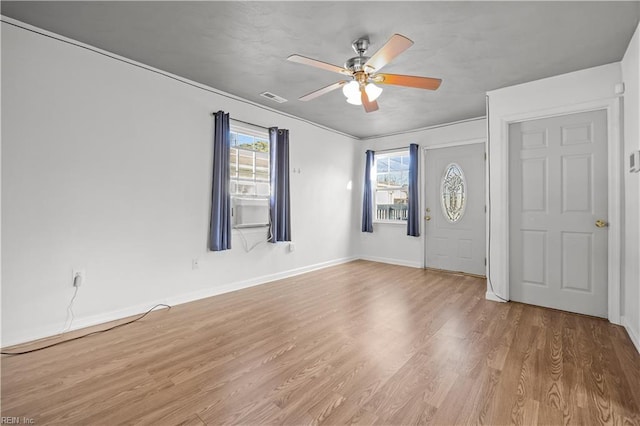 foyer entrance with ceiling fan and light hardwood / wood-style floors