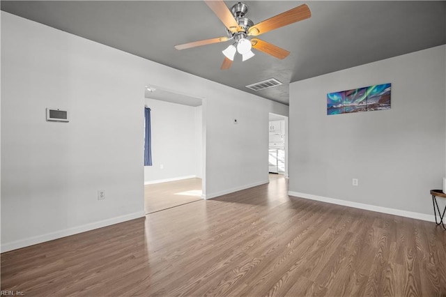 unfurnished room with wood-type flooring and ceiling fan