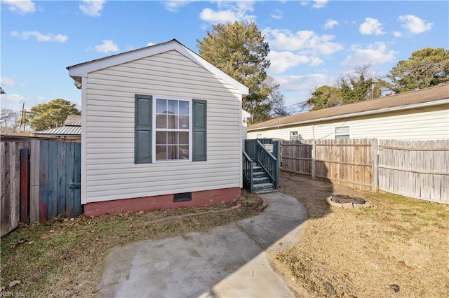 view of side of home featuring a yard