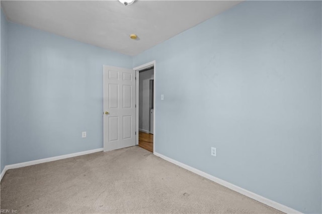 empty room with light colored carpet