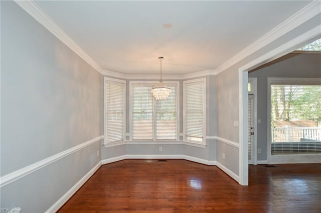 unfurnished dining area featuring crown molding, an inviting chandelier, and dark hardwood / wood-style flooring