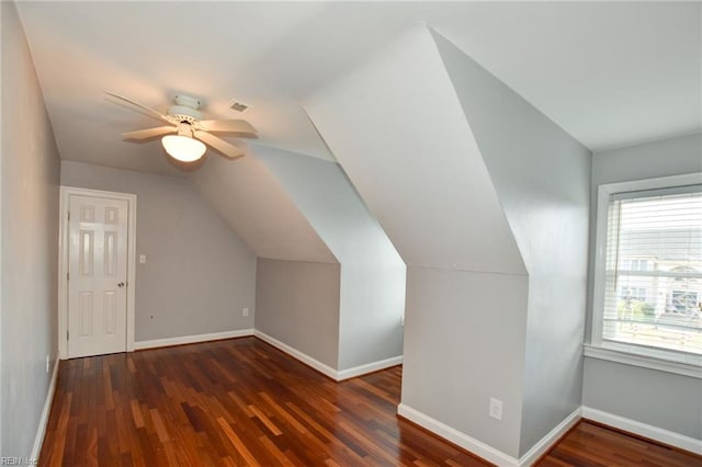 additional living space featuring ceiling fan, lofted ceiling, and dark hardwood / wood-style flooring