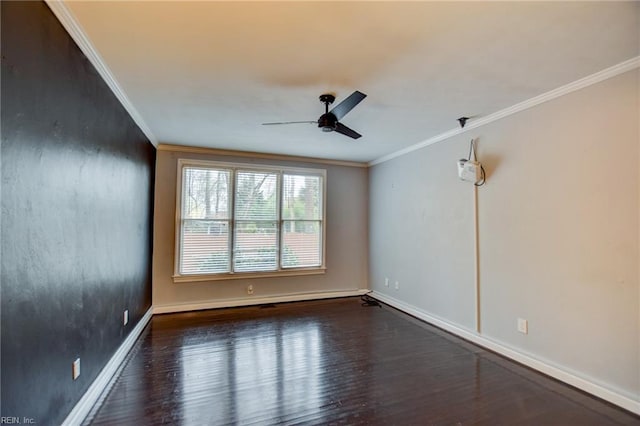 spare room featuring crown molding, ceiling fan, and dark hardwood / wood-style flooring