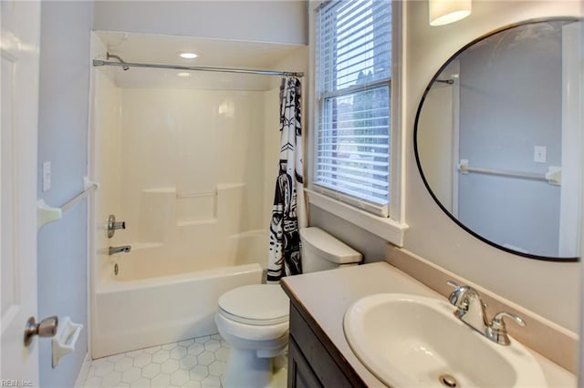 full bathroom with vanity, shower / bathtub combination with curtain, and toilet