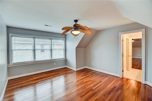 bonus room featuring hardwood / wood-style flooring, vaulted ceiling, and ceiling fan