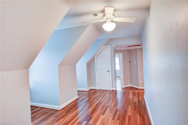 additional living space featuring vaulted ceiling, ceiling fan, and light hardwood / wood-style flooring