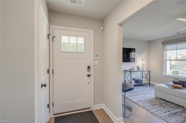 entrance foyer with hardwood / wood-style floors