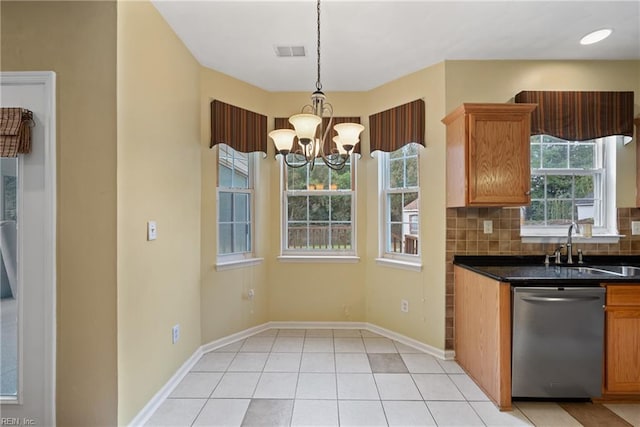 kitchen featuring pendant lighting, visible vents, backsplash, stainless steel dishwasher, and light tile patterned flooring