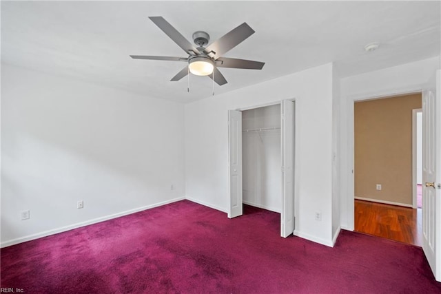 unfurnished bedroom featuring a ceiling fan, dark colored carpet, a closet, and baseboards