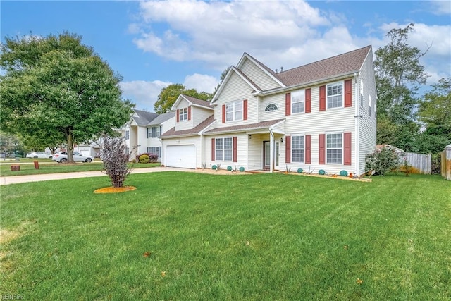 view of front facade with a garage, concrete driveway, a front yard, and fence