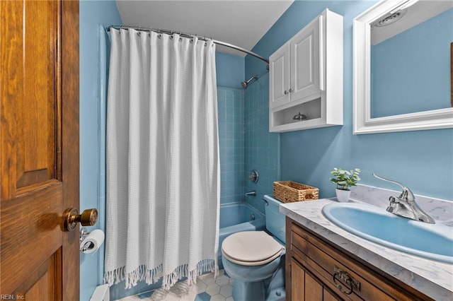 full bathroom featuring vanity, shower / bath combination with curtain, and toilet