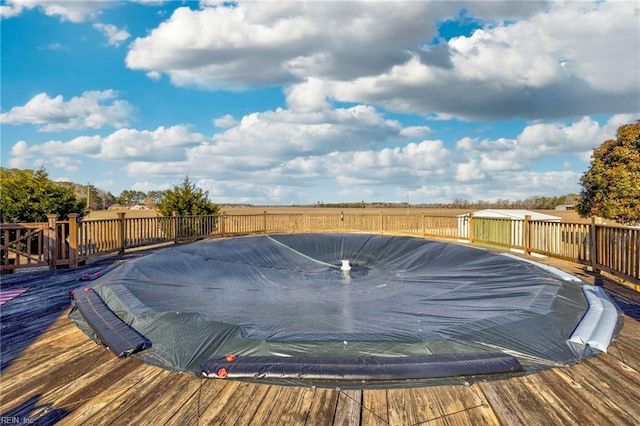 view of pool with a deck