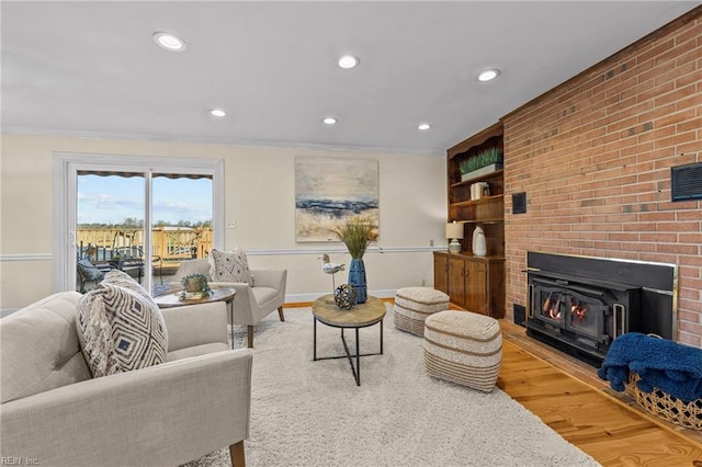 living room featuring crown molding and hardwood / wood-style floors