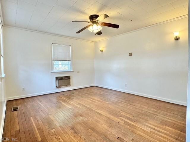 unfurnished living room featuring heating unit, crown molding, light hardwood / wood-style flooring, and ceiling fan