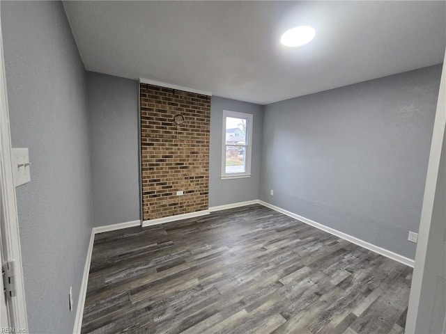 unfurnished room with dark hardwood / wood-style floors