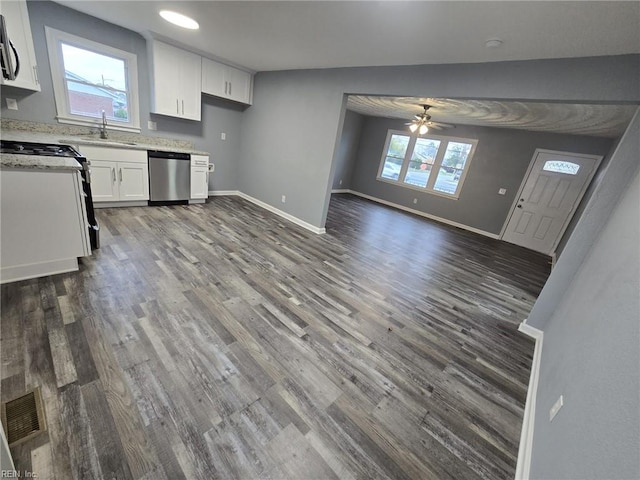 kitchen featuring dark hardwood / wood-style floors, dishwasher, sink, and white cabinets