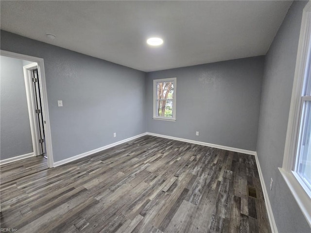 empty room featuring dark hardwood / wood-style floors